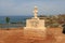 The Idol of Pomos on a welcome sign