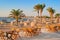 Idylic beach with palms and sun umbrelas, Red Sea, Egypt