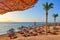 Idylic beach with palms and sun umbrelas, Red Sea, Egypt