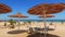 Idylic hotel beach with sun umbrelas, Red Sea, Egypt