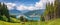 Idyllic alpine landscape with cows grazing and famous Zeller Lake, Salzburg, Austria