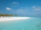 Idyllic Beach on Maldives on Meeru Island with Palm Trees