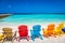 Idyllic beach with rustic adirondack chairs in Aruba, Dutch Antilles