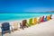 Idyllic beach with rustic adirondack chairs in Aruba, Dutch Antilles