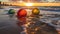 Idyllic beach scene at sunset, with three colorful balls on the sand. AI-generated.