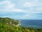 Idyllic Beach view over Bay with blue sky, sea and cliffs green nature. Island view from Nang Yuan Island in Gulf of Thailand in