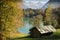 Idyllic cabin in fall at a turquoise lake