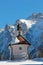 Idyllic chapel in wintry landscape