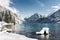 Idyllic cold lake at snow mountain landscape
