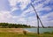 Idyllic countryside scene with an old water well sweep shadoof near the Delia lake Moldova. Also called a counterpoise lift or