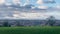 Idyllic English countryside view with vibrant green fields under a blue sky in early spring in Hemel Hempstead