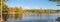 Idyllic fall foliage scene with reflections on lake