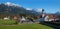 Idyllic health resort Wallgau, with traditional bavarian church, snowy mountain peaks, in spring