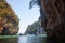 idyllic holiday background  tropical island Koh Hong - longtail boats among limestone rocks, Thailand