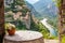 Idyllic Italian Retreat: A Moment of Serenity, View to an Italian village and river from balcony with table