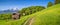 Idyllic landscape in the Alps with traditional mountain lodge in spring