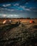 Idyllic landscape with large spheric boulders in a rural grassy field