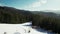 Idyllic landscape in winter mountains. Snow-covered clearing in the forest.