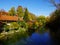 Idyllic living on the riverside between autumn trees