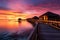 Idyllic Maldives sunset, overwater villas, sandy beach a travel daydream