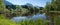 Idyllic moor lake near oberstdorf and view to allgau alps