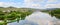 Idyllic mosel river at springtime, hillside vineyards