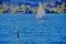 Idyllic mountain lake with single  sailboat and mountains with autumn forest in the background 3