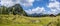 Idyllic mountain landscape in the alps: Mountain chalet, meadows and blue sky