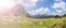 Idyllic mountain landscape in the alps: Mountain chalet, meadows and blue sky