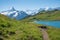 Idyllic mountain landscape Grindelwald First, hiking trail around lake Bachalpsee, with view to Bernese alps