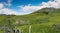 Idyllic mountain landscape in the summertime with a traditional wooden fence in the foreground