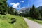 Idyllic mountain scene with a bench in the foreground. Austrian alps, Tyrol, Wilder Kaiser