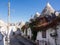 Idyllic narrow cobblestone street lined with traditional white-washed houses in Aberobelo, Italy