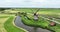 Idyllic old dutch historic traditional windmill aerial drone overhead overview. Historic typical dutch culture and