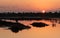 Idyllic orange sunrise big sun and twilight sky at the lake. Larnaca Cyprus