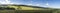 Idyllic panorama from farmland and meadows