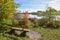 idyllic place with wooden bench, lake shore egglburg, upper bavaria