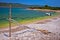 Idyllic rocky beach Sakarun and small boat on Dugi Otok island