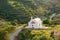 Idyllic rural landscape with hills covered by olive trees and tiny peaceful orthodox church in beautiful sunset light, Crete,