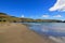 Idyllic sand beach on Akaroa peninsula in New Zealand