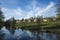 Idyllic scandinavian spring evening, amazing clouds reflecting in water of Black river Svarton in Vasteras city, Sweden