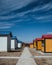 Idyllic scene of a picturesque pathway lined with colorful huts in Tanda Ziarat Guest, Pakistan