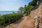 Idyllic seaside promenade with fence, along Moscenicka Draga coastlilne, with view to Losinj island, croatia