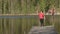 Idyllic shot of a caucasian lady taking pictures on a floating swimming bridge.