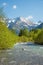 Idyllic spring landscape allgau alps, river Stillach and valley, mountains with snowy peak, south germany vertical shot