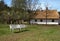 idyllic spring landscape, benches and fruit trees in the village