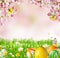 Idyllic spring meadow with Easter eggs and butterflies with blossoms.