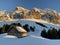 Idyllic Swiss alpine mountain huts dressed in winter clothes and in a fresh snow cover on slopes on the Alpstein mountain range