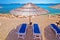 Idyllic turquoise beach parasol and deck chair in Orebic