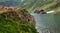 Idyllic view with cottege on Balea Lake shore in Fagaras Mountains